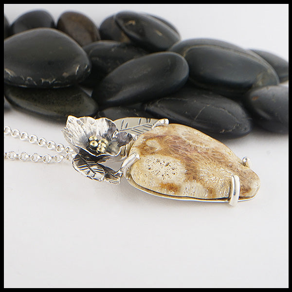 Profile view of Fossilized Coral Blossom Pendant